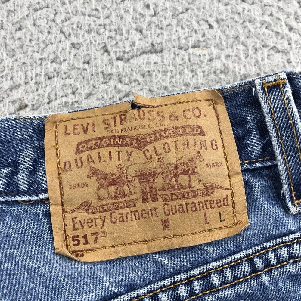 Vintage Levis Jeans Womens 28x29 Blue 517 Bootcut Raw Hem 90s Made In USA